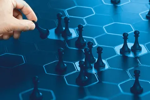 Chess pieces on a blue strategy board